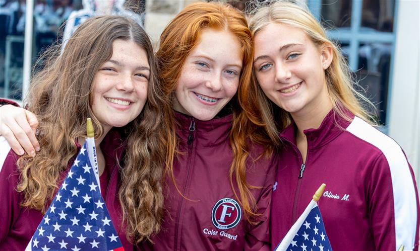 Students march in a Veterans Day Parade